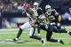 NEW ORLEANS, LA - NOVEMBER 5: Mike Evans #13 of the Tampa Bay Buccaneers is tackled from behind by Marshon Lattimore #23 of the New Orleans Saints at Mercedes-Benz Superdome on November 5, 2017 in New Orleans, Louisiana. The Saints defeated the Buccaneers 30-10. (Photo by Wesley Hitt/Getty Images)