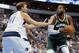 Dallas Mavericks forward Dirk Nowitzki (41) defends as Milwaukee Bucks center Greg Monroe (15) works to the basket during the first half of a preseason NBA basketball game, Monday, Oct. 2, 2017, in Dallas. (AP Photo/Tony Gutierrez)
