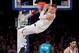 NEW YORK, NY - NOVEMBER 07: Kristaps Porzingis #6 of the New York Knicks hangs on the rim after dunking the ball in the second quarter against the Charlotte Hornets during their game at Madison Square Garden on November 7, 2017 in New York City. NOTE TO USER: User expressly acknowledges and agrees that, by downloading and or using this photograph, User is consenting to the terms and conditions of the Getty Images License Agreement. (Photo by Abbie Parr/Getty Images)