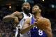 Philadelphia 76ers' Jahlil Okafor (8) looks to shoot against Milwaukee Bucks' Greg Monroe during an NBA basketball game Wednesday, Dec. 23, 2015, in Milwaukee. (AP Photo/Aaron Gash)