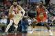 FILe - At left, in a Jan. 2, 2017, file photo, Chicago Bulls forward Nikola Mirotic brings the ball up court against the Charlotte Hornets during the second half of an NBA basketball game in Chicago. At right, in an Oct. 4, 2017, file photo, Chicago Bulls' Bobby Portis (5) handles the ball during a preseason NBA basketball game against the Dallas Mavericks, in Dallas. The Chicago Bulls have suspended forward Bobby Portis for the first eight games for injuring teammate Nikola Mirotic during a fight at practice. Mirotic suffered multiple broken bones in his face as well as a concussion on Tuesday. He will likely need surgery and is out indefinitely. The team announced the suspension on Wednesday, Oct. 18, 2017. (AP Photo/Tony Gutierrez)