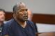 FILE - In this May 14, 2013, file photo, O.J. Simpson appears at an evidentiary hearing in Clark County District Court in Las Vegas. A Nevada prison official said early Sunday, Oct. 1, 2017, O.J. Simpson, the former football legend and Hollywood star, has been released from a Nevada prison in Lovelock after serving nine years for armed robbery. (Ethan Miller via AP, Pool, File)