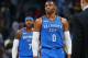 Oklahoma City Thunder guard Russell Westbrook, front, and forward Carmelo Anthony head off the court as time runs out in the second half of an NBA basketball game against the Denver Nuggets late Thursday, Nov. 9, 2017, in Denver. The Nuggets won 102-94. (AP Photo/David Zalubowski)