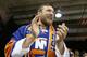 Retired American professional wrestler Bryan Lloyd Danielson, whose WWE ring name is Daniel Bryan, applauds during the second period of an NHL hockey game between the New York Islanders and the Anaheim Ducks, Sunday, Oct. 16, 2016, in New York. (AP Photo/Kathy Willens)