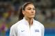 United States goalkeeper Hope Solo stands as players listen to the national anthems before a women's Olympic football tournament match against New Zealand at the Mineirao stadium in Belo Horizonte, Brazil, Wednesday, Aug. 3, 2016. Solo says she was not bothered by fans who chanted