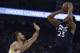 Minnesota Timberwolves' Jimmy Butler (23) shoots against Golden State Warriors' Stephen Curry during the first half of an NBA basketball game Wednesday, Nov. 8, 2017, in Oakland, Calif. (AP Photo/Ben Margot)