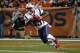 New England Patriots running back Dion Lewis (33) runs back a kick-off for a touchdown against the Denver Broncos during the first half of an NFL football game, Sunday, Nov. 12, 2017, in Denver. (AP Photo/Jack Dempsey)