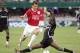 South Africa's Orlando Pirates defender Lehlohonolo Seema, right, fights for the ball with Manchester United midfielder Liam Miller, left, during the soccer Vodacom Challenge against Manchester United in Durban, South Africa, Saturday, July 15, 2006. (AP Photo/Themba Hadebe)