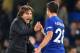 Chelsea's Italian head coach Antonio Conte celebrates on the pitch with Chelsea's Spanish defender Cesar Azpilicueta (R) after the English Premier League football match between Chelsea and Manchester United at Stamford Bridge in London on November 5, 2017.
Chelsea won the game 1-0. / AFP PHOTO / Glyn KIRK / RESTRICTED TO EDITORIAL USE. No use with unauthorized audio, video, data, fixture lists, club/league logos or 'live' services. Online in-match use limited to 75 images, no video emulation. No use in betting, games or single club/league/player publications. / (Photo credit should read GLYN KIRK/AFP/Getty Images)