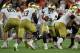 MIAMI GARDENS, FL - NOVEMBER 11: Brandon Wimbush #7 of the Notre Dame Fighting Irish hands off to Josh Adams #33 during a game against the Miami Hurricanes at Hard Rock Stadium on November 11, 2017 in Miami Gardens, Florida. (Photo by Mike Ehrmann/Getty Images)