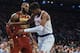 Cleveland Cavaliers' LeBron James, center, discusses with New York Knicks' Frank Ntilikina, right, during the first half of a NBA basketball game at Madison Square Garden in New York, Monday, Nov. 13, 2017. (AP Photo/Andres Kudacki)