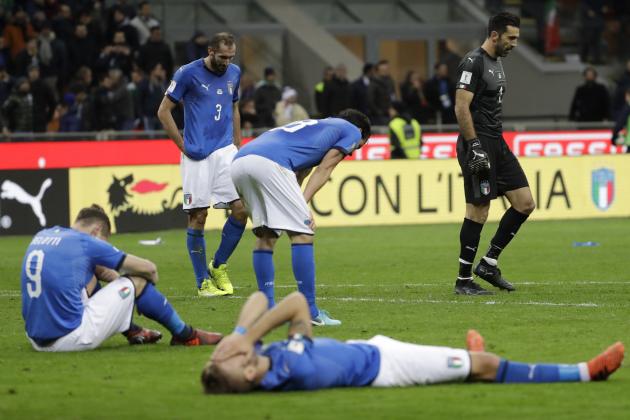 Italian players react to their elimination at the end of the World Cup qualifying play-off second leg soccer match between Italy and Sweden, at the Milan San Siro stadium, Italy, Monday, Nov. 13, 2017. (AP Photo/Luca Bruno)