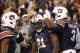 Auburn running back Kerryon Johnson, center, is congratulated after scoring a touchdown during the second half of an NCAA college football game against Georgia, Saturday, Nov. 11, 2017, in Auburn, Ala. Auburn won 40-17. (AP Photo/Brynn Anderson)