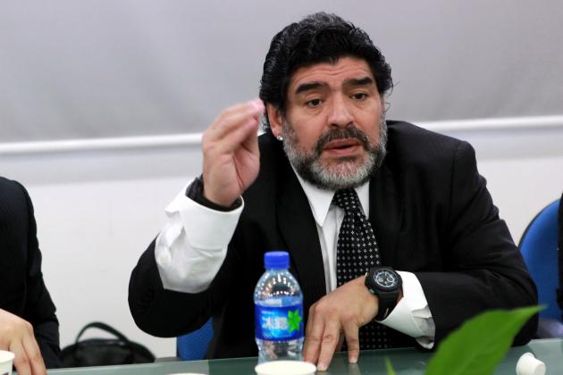 Argentine football great Diego Maradona talks during a meeting with Wei Di, head of the Chinese Football Association, in Beijing on August 16, 2012.  Maradona is in Beijing for an eight-day charity tour, while Chinese state media reported that the Argentine football great wants to coach in China, where clubs are spending big bucks to lure international names.       CHINA OUT           AFP PHOTO        (Photo credit should read STR/AFP/GettyImages)