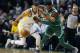 Boston Celtics' Jaylen Brown (7) and Golden State Warriors' Stephen Curry battle for a loose ball during the first quarter of an NBA basketball game in Boston, Thursday, Nov. 16, 2017. (AP Photo/Michael Dwyer)
