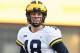 COLLEGE PARK, MD - NOVEMBER 11: Brandon Peters #18 of the Michigan Wolverines looks on during a college football game against the Maryland Terrapins at Capitol One Field on November 11, 2017 in College Park, Maryland. The Wolverines won 84-75. (Photo by Mitchell Layton/Getty Images)