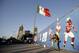 Fans interact during NFL football's Fan Fest at Zocalo Square Saturday, Nov. 18, 2017, in Mexico City. Thousands of football fans descended on the city's historic main plaza Saturday, one day before the New England Patriots face the Oakland Raiders in a football game at Aztec Stadium. (AP Photo/Gregory Bull)