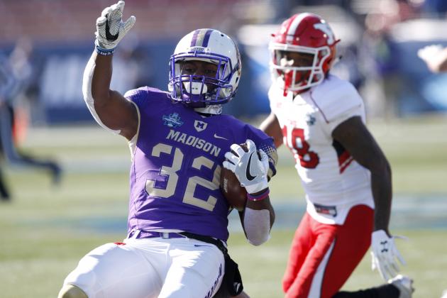 James Madison running back Khalid Abdullah (32) is stopped after a short run by Youngstown State defenders during the FCS championship NCAA college football game, Saturday, Jan. 7, 2017, in Frisco, Texas. (AP Photo/Sarah Warnock)