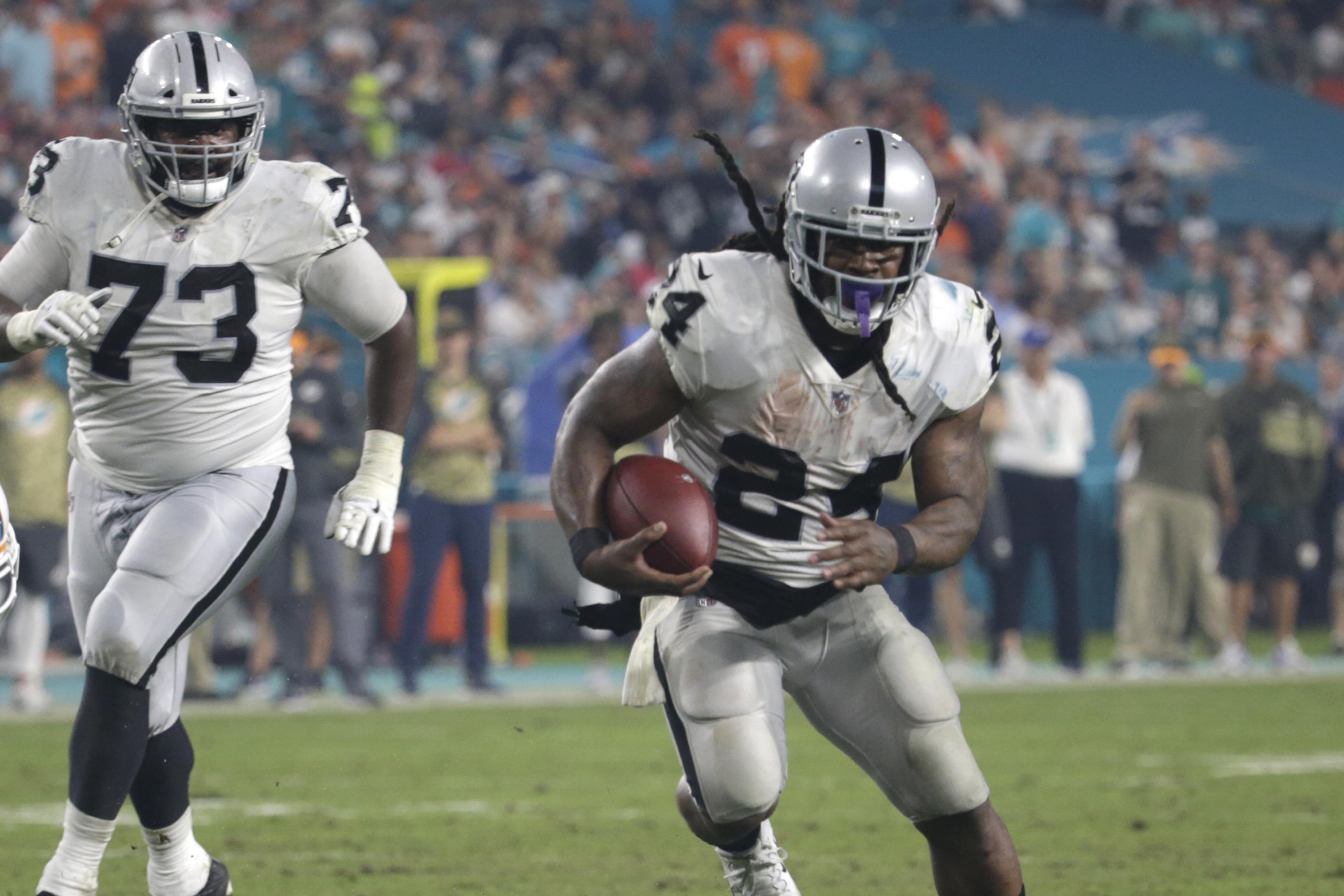 Oakland Raiders's Marshawn Lynch sits during national anthem