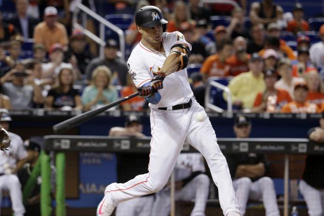 Miami Marlins' Giancarlo Stanton hits a single during the third inning of a baseball game against the Atlanta Braves, Sunday, Oct. 1, 2017, in Miami. (AP Photo/Lynne Sladky)