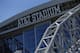 An exterior view of the AT&T logo at the top of the stadium is shown before an NFL football game between the Green Bay Packers and Dallas Cowboys on Sunday, Oct. 8, 2017, in Arlington, Texas. (AP Photo/Ron Jenkins)