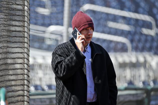 Atlanta Braves general manager John Coppolella talks on the phone before a baseball game against the Washington Nationals at Nationals Park, Wednesday, April 13, 2016, in Washington. Braves outfielder Hector Olivera was placed on paid administrative leave by Major League Baseball after he was arrested when a woman accused him of assault at a hotel outside Washington. (AP Photo/Alex Brandon) Atlanta Braves general manager John Coppolella talks on the phone before a baseball game against the Washington Nationals at Nationals Park, Wednesday, April 13, 2016, in Washington. Braves outfielder Hector Olivera was placed on paid administrative leave by Major League Baseball after he was arrested when a woman accused him of assault at a hotel outside Washington. (AP Photo/Alex Brandon)