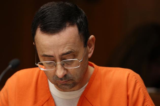 Former Michigan State University and USA Gymnastics doctor Larry Nassar is seen in the 55th District Court where Judge Donald Allen Jr. bound him over on June 23, 2017 in Mason, Michigan to stand trial on 12 counts of first-degree criminal sexual conduct. / AFP PHOTO / JEFF KOWALSKY        (Photo credit should read JEFF KOWALSKY/AFP/Getty Images)
