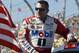 Tony Stewart looks on during driver introductions for the NASCAR Sprint Cup Series auto race at Phoenix International Raceway, Sunday, Nov. 13, 2016, in Avondale, Ariz. (AP Photo/Ralph Freso)