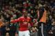 Manchester United's French midfielder Paul Pogba (L) greets Manchester United's Swedish striker Zlatan Ibrahimovic (R) as Pogba leaves the pitch substituted during the English Premier League football match between Manchester United and Newcastle at Old Trafford in Manchester, north west England, on November 18, 2017. / AFP PHOTO / Oli SCARFF / RESTRICTED TO EDITORIAL USE. No use with unauthorized audio, video, data, fixture lists, club/league logos or 'live' services. Online in-match use limited to 75 images, no video emulation. No use in betting, games or single club/league/player publications. / (Photo credit should read OLI SCARFF/AFP/Getty Images)