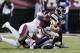 Mississippi State quarterback Nick Fitzgerald, right, is tackled by Mississippi defenders and is injured during the first half of an NCAA college football game in Starkville, Miss., Thursday, Nov. 23, 2017. Fitzgerald left the field on a cart. (AP Photo/Rogelio V. Solis)