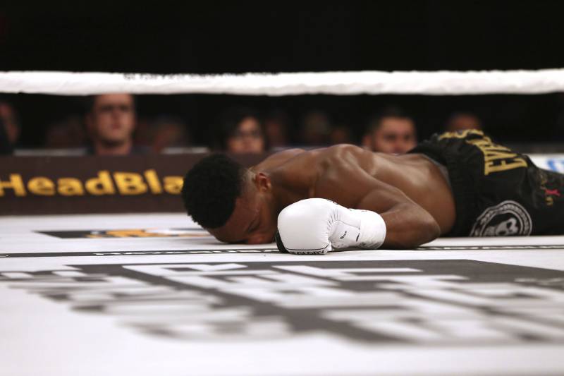 Terrence Hill is down after bring knocked out by Chenchen Li in the first round of a Glory 43 kickboxing match, Friday, July 14, 2017, in New York. (AP Photo/Steve Luciano)