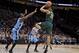 Michigan State guard Miles Bridges, right, shoots over North Carolina forward Theo Pinson during the first half of an NCAA college basketball game in the Phil Knight Invitational tournament in Portland, Ore., Sunday, Nov. 26, 2017. (AP Photo/Craig Mitchelldyer)