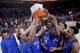 Duke holds up the championship trophy after an NCAA college basketball game against Florida in the Phil Knight Invitational tournament in Portland, Ore., Sunday, Nov. 26, 2017. Duke won 87-84. (AP Photo/Craig Mitchelldyer)