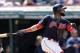 Cleveland Indians' Carlos Santana watches his ball after hitting a one-run double off Baltimore Orioles starting pitcher Gabriel Ynoa in the fifth inning of a baseball game, Saturday, Sept. 9, 2017, in Cleveland. Lonnie Chisenhall scored on the play. (AP Photo/Tony Dejak)