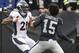 Denver Broncos cornerback Aqib Talib (21) fights Oakland Raiders wide receiver Michael Crabtree (15) during the first half of an NFL football game in Oakland, Calif., Sunday, Nov. 26, 2017. (AP Photo/Ben Margot)
