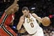 Cleveland Cavaliers' Kevin Love (0) drives against Miami Heat's Hassan Whiteside (21) in the first half of an NBA basketball game, Tuesday, Nov. 28, 2017, in Cleveland. (AP Photo/Tony Dejak)