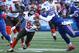 ORCHARD PARK, NY - December 18: Corey Coleman # 19 of Cleveland Browns runs with the ball while being tackled by Lorenzo Alexander # 57 of Buffalo Bills grabs his mask during the NFL game action at New Era Field on December 18, 2016 in Orchard Park, New York. (Photo by Tom Szczerbowski / Getty Images)