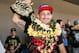 HONOLULU, HI - JUNE 05: Max Holloway raises his UFC Championship belt as he greets his fans upon his arrival at the Daniel K. Inouye International Airport on June 5, 2017 in Honolulu, Hawaii. Holloway became the the undisputed UFC Featherweight Champion after beating Jose Aldo. (Photo by Zuffa LLC/Zuffa LLC via Getty Images)