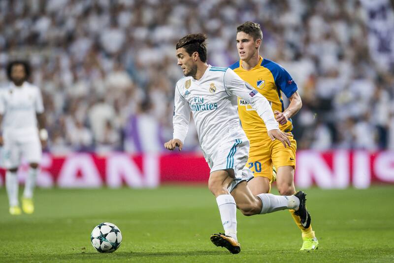 MADRID, SPAIN - SEPTEMBER 13: Mateo Kovacic (l) of Real Madrid runs past Roland Sallai of APOEL FC during the UEFA Champions League 2017-18 match between Real Madrid and APOEL FC at Estadio Santiago Bernabeu on 13 September 2017 in Madrid, Spain. (Photo by Power Sport Images/Getty Images)