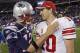 ADVANCE FOR WEEKEND EDITIONS, JAN. 28-29 -FILE - In this Nov. 6, 2011, file photo, New York Giants' Eli Manning, right, is congratulated by New England Patriots' Tom Brady after the Giants' 24-20 win in an NFL football game in Foxborough, Mass. The Patriots face the Giants in Super Bowl XLVI on Sunday, Feb. 5, 2012, in Indianapolis. (AP Photo/Charles Krupa, File)