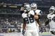 Dallas Cowboys wide receiver Dez Bryant (88) and guard Zack Martin, rear, celebrate a touchdown scored on a catch by Bryant in the second half of an NFL football game against the Washington Redskins on Thursday, Nov. 30, 2017, in Arlington, Texas. (AP Photo/Ron Jenkins)