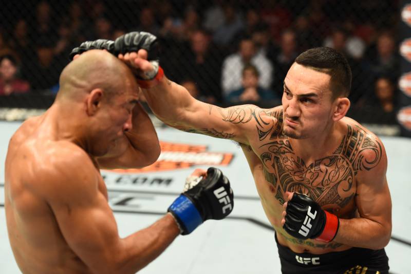 DETROIT, MI - DECEMBER 02: (R-L) Max Holloway punches Jose Aldo of Brazil in their UFC featherweight championship bout during the UFC 218 event inside Little Caesars Arena on December 02, 2017 in Detroit, Michigan. (Photo by Josh Hedges/Zuffa LLC/Zuffa LLC via Getty Images)