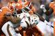 CHARLOTTE, NC - DECEMBER 02: Justin Foster #35 of the Clemson Tigers leads a tackle of Malik Rosier #12 of the Miami Hurricanes during the ACC Football Championship at Bank of America Stadium on December 2, 2017 in Charlotte, North Carolina. (Photo by Mike Comer/Getty Images)