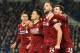 Liverpool's English midfielder Jordan Henderson (2R), Liverpool's Scottish defender Andrew Robertson (R) and Liverpool's Brazilian midfielder Roberto Firmino (L) celebrate after Liverpool's Brazilian midfielder Philippe Coutinho (2L) scored their fourth goal during the English Premier League football match between Brighton and Hove Albion and Liverpool at the American Express Community Stadium in Brighton, southern England on December 2, 2017. / AFP PHOTO / Glyn KIRK / RESTRICTED TO EDITORIAL USE. No use with unauthorized audio, video, data, fixture lists, club/league logos or 'live' services. Online in-match use limited to 75 images, no video emulation. No use in betting, games or single club/league/player publications. / (Photo credit should read GLYN KIRK/AFP/Getty Images)
