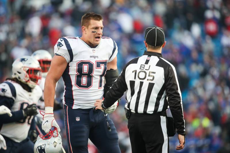 ORCHARD PARK, NY - DECEMBER 3: Rob Gronkowski #87 of the New England Patriots talks with back judge Dino Paganelli #105 during the fourth quarter against the Buffalo Bills on December 3, 2017 at New Era Field in Orchard Park, New York. (Photo by Tom Szczerbowski/Getty Images)