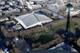 FILE - In this Jan. 29, 2015, file photo, KeyArena, which hosts sports and entertainment events, is seen from the air next to the shadow of the Space Needle in Seattle. Seattle Mayor Ed Murray announced Wednesday, June 7, 2017, that the city will enter into negotiations with the Oak View Group on a proposal for a privately-financed renovation of the city-owned KeyArena. Plans for the remodel would bring the building up to standards that could attract an NHL hockey or NBA basketball team once completed. (AP Photo/Ted S. Warren)