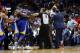 Golden State Warriors forward Kevin Durant and New Orleans Pelicans center DeMarcus Cousins (0) are restrained while going after each other during a scuffle in the second half of an NBA basketball game in New Orleans, Monday, Dec. 4, 2017. Both players were ejected from the game, and the Warriors won 125-115. (AP Photo/Gerald Herbert)