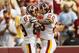 Washington Redskins Santana Moss (89) and Clinton Portis (26) celebrate after Moss converted a 4th down reception for 8 yards and a first down to clinch their win late in the 4th quarter during their NFL game against the New Orleans Saints at Fedex Field in Landover, Sunday, Sept. 14, 2008. The Redskins won 29-24. (AP Photo/Gerald Herbert)