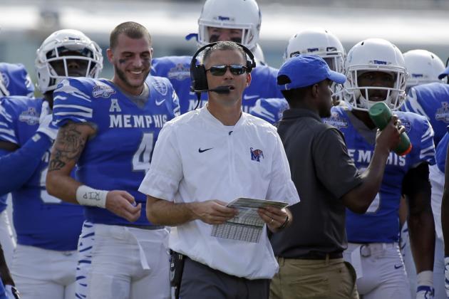 Memphis head coach Mike Norvell looks up at the scoreboard during a timeout in the first half of the American Athletic Conference championship NCAA college football game against Central Florida, Saturday, Dec. 2, 2017, in Orlando, Fla. (AP Photo/John Raoux)