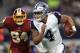 ARLINGTON, TX - NOVEMBER 30: Preston Smith #94 of the Washington Redskins pursues Dak Prescott #4 of the Dallas Cowboys in the first half of a football game at AT&T Stadium on November 30, 2017 in Arlington, Texas. (Photo by Ronald Martinez/Getty Images)